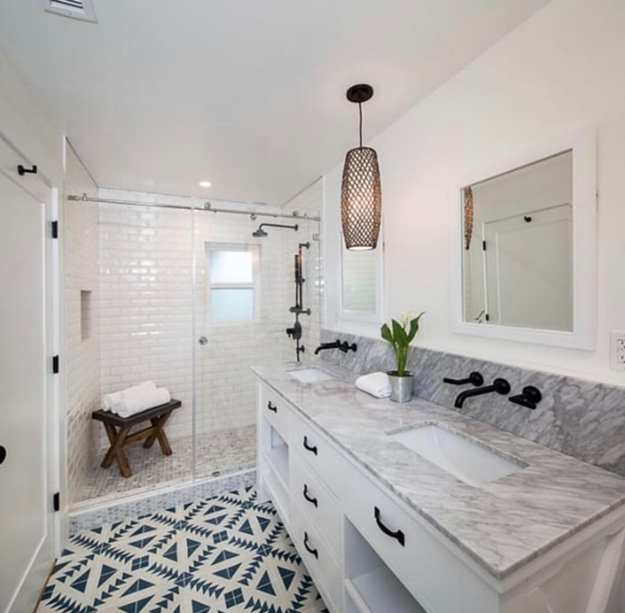 &2 inch white vanity with white shower wall tile and blue and white tile floor, 